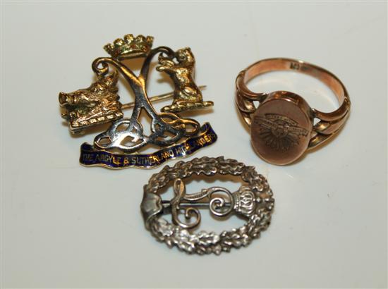 10ct gold military locket ring, military brooch and a silver badge.